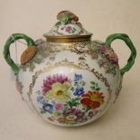 A 19th century Meissen porcelain globular shaped bowl and cover with twin interwoven handles,