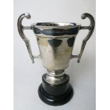 A 1930s art deco silver trophy cup with inscription for the Golf Society on black base, London 1936