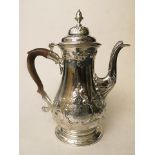 A mid 18th century Georgian silver coffee pot having ornate rococo style decoration, London 1759