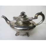 An early Victorian silver teapot with ornate cast rims, dated London 1839