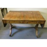 A William IV rosewood sofa table having two short drawers standing on rectangular and gadroon