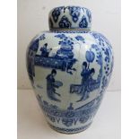 A large Kangxi Chinese porcelain blue and white vase and lid depicting artifacts and styalized