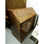 A Georgian  mahogany bureau, the fall flap enclosing central cupboard flanked by short drawers and