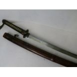 A 19th century Japanese sword having a cast hand guard with leather scabbard