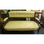 A 19th century walnut show wood framed salon sofa with cream upholstery, spindle back over turned