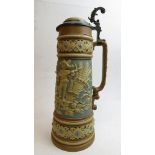 A late 19th century German Metlach pottery stein with pewter mounted lid and all over raised