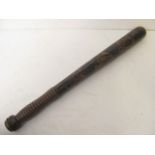 A 19th century treen truncheon having painted and gilt highlight decoration, turned handle