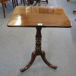 A 19th century mahogany tea table on turned column and splayed legs