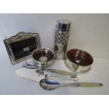 A silver plated incense bottle, two silver wine coasters, cutlery and a picture frame