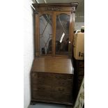 A 19th century Robson & Sons mahogany bureau bookcase having moulded frames over a fitted interior