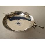 An arts & crafts silver early 20th century twin handled bowl having a hand beaten surface with