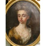 Circa 1780 an oval oil on canvas portrait of a young lady in a yellow silk dress, in a later gilt