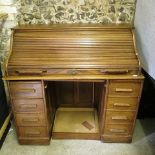 An oak roll top desk