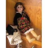 Circa 1900, Simon & Halbig bisque headed doll in a Scottish outfit having brown sleeping eyes,