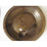 A 19th century Provincial turned treen bowl with a carved treen ladle, 18 diameter