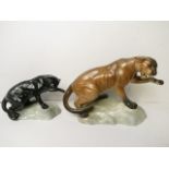 A Beswick pottery model of a black puma on a rocky base, model no 1823 and a Beswick pottery model