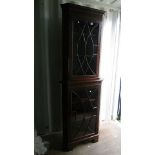 Edwardian mahogany corner cabinet, stepped and Greek key moulded cornice, above a blind fretwork