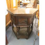 A small and rare oak credence table of triangular form, the hinged top supported by a single gate