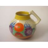 A Clarice Cliff Bizarre foliate decorated jug, 8 high