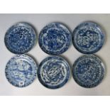 A group of five 18th century Chinese blue and white plates decorated with two dragons chasing a