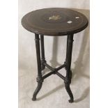 A 19th century occasional table having an inset micro mosaic plaque depicting birds over an ebonized