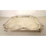 A square formed silver tray having cast, raised feet, Sheffield 1922, 8
