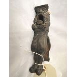 A 19th century German treen carved nut cracker in the form of a gentleman in a hat, with opening