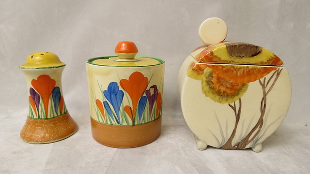 A Clarice Cliff Crocus pattern preserve jar and lid, Crocus pattern pepper pot, A/F and a Clarice