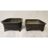 Two 19th century bronze, square formed censers having raised decoration, one depicting a dragon,