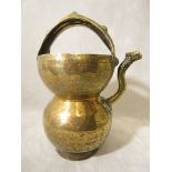 An 18th/19th century Persian brass water vessel with all over geometric designs, 12 high A/F