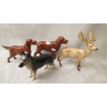 A group of four Beswick pottery figurines to include a red setter and a reindeer