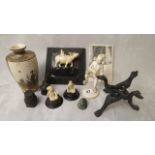 A late 19th century Japanese carved ivory figure of a young man, two ivory miniatures, three