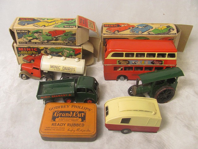 A collection of vintage boxed Minic toys to include a caravan