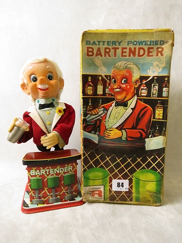 A vintage boxed Rosco battery operated bar tender