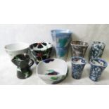 A group of Janice Tchalenko Dartington studio pottery bowls and vases to include a black poppy