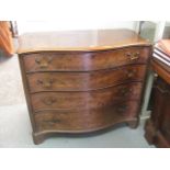 An 18th century mahogany serpentine fronted chest of four long drawers having brass handles,