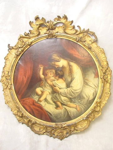 Circa 1890 a continental ornate gilt oval frame holding an oil on canvas, mother and children, 21