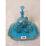 A 19th century glass tray, decanter and cups with gilt highlights