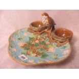 A 19th century George Jones, strawberry dish mounted with a sparrow flanking two cream baskets,