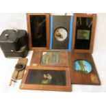 A vintage Baby Camo cine camera together with a group of 19th century coloured lantern slides,