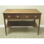 A 19th Century mahogany Washstand with cross-banded top above two drawers and shaped under tier on