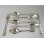 Four early 19th Century silver Dessert Spoons fiddle and thread pattern, two Forks and a Teaspoon