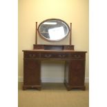 A Waring and Gillow Ltd mahogany Dressing Table with oval mirror, fitted three frieze drawers