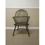 A primitive ash and elm stick back Elbow Chair with hoop back on turned supports