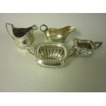 A George III silver Milk Jug with reeded rim, London 1806, Sauce Boat, Birmingham 1925 and a semi-