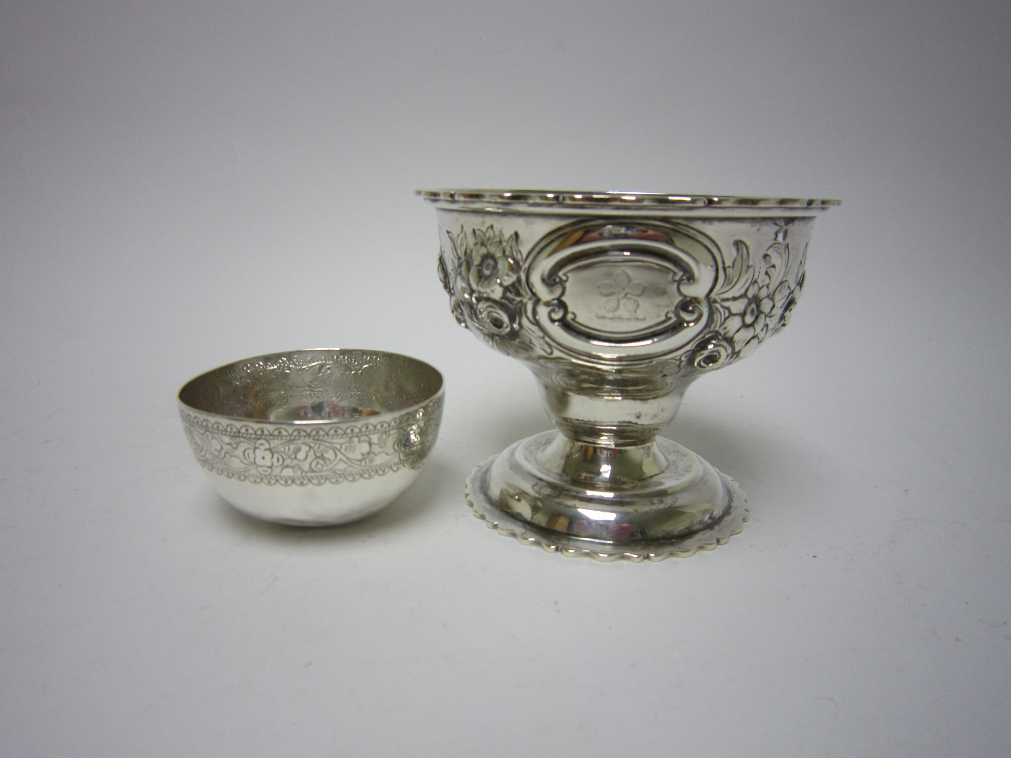 A Victorian silver pedestal Sugar Bowl with floral embossing and oval cartouches, London 1875 and