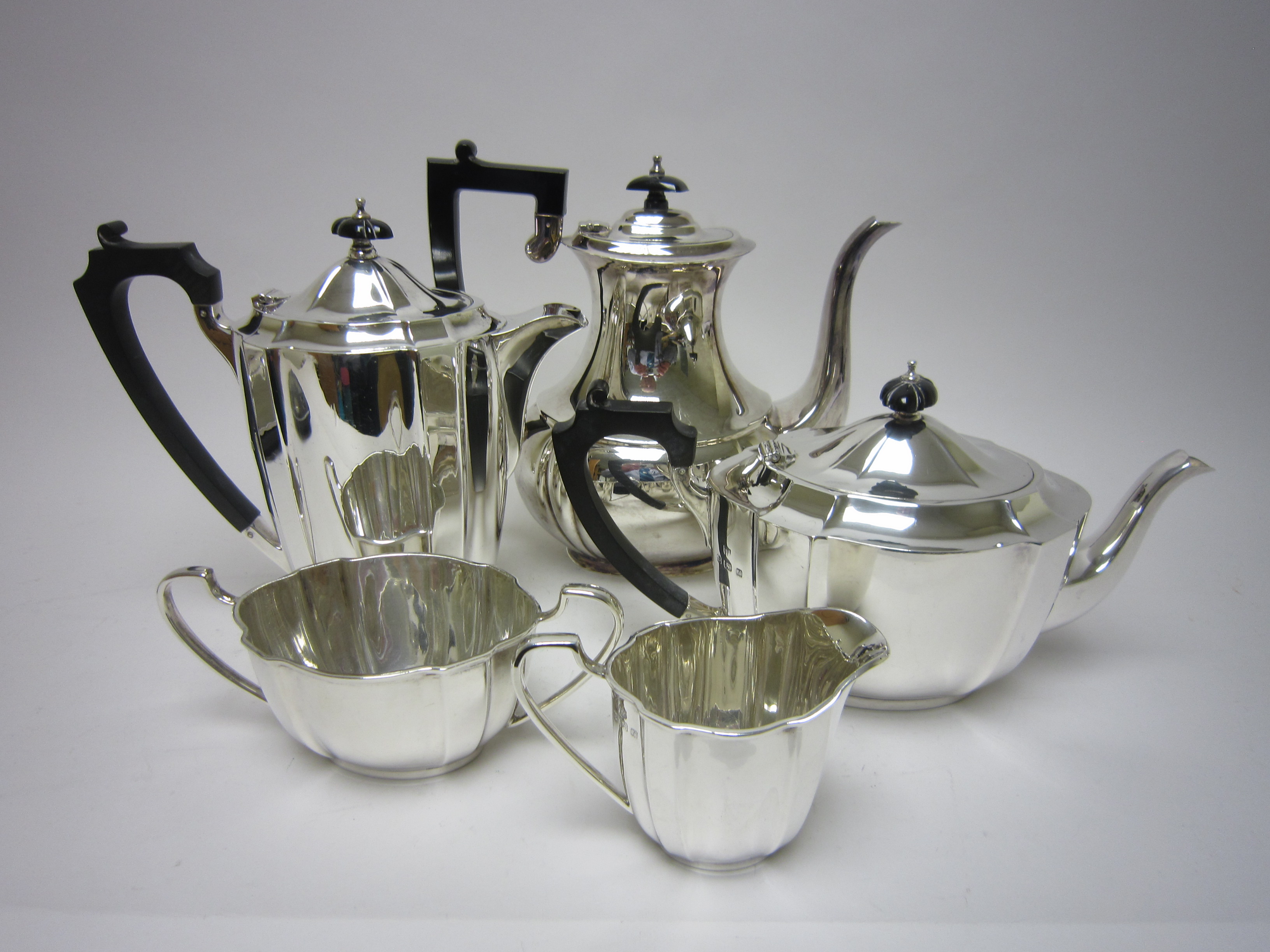 An Edward VIII/George VI four piece silver shaped oval Tea Service, Birmingham 1936/7 and a plated