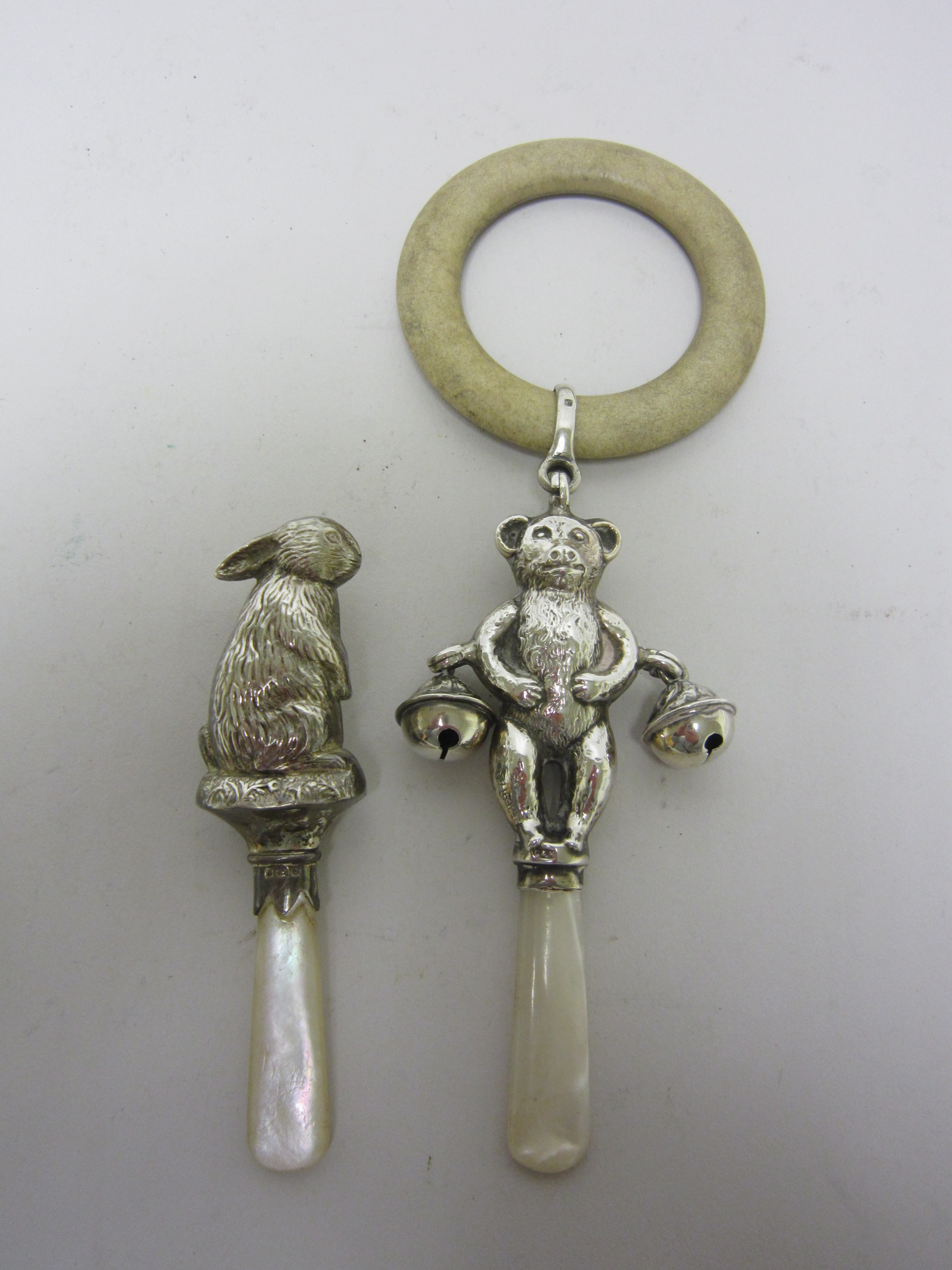 A George V silver Rattle in the form of a Teddy Bear with applied bells, Birmingham 1933, and a