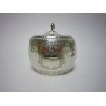 A Victorian silver oval Tea Caddy with engraved frieze and vacant shield shape cartouche, London