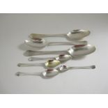 Three 18th Century silver bottom marked Table Spoons hanoverian pattern with pattern backs, and four